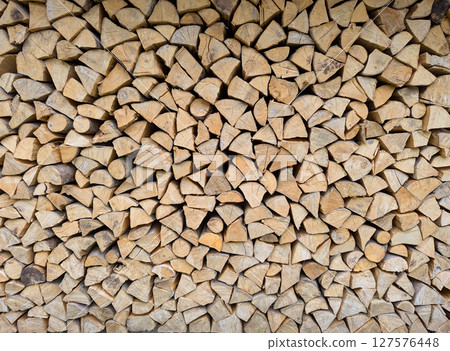 Cross-section background of a large number of firewood piles 127576448