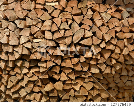 Cross-section background of a large number of firewood piles 127576459