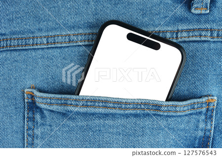 Mockup of modern smartphone with blank screen sticking out of blue denim jeans front pocket close up Mockup of modern smartphone with blank screen sticking out of blue denim jeans front pocket close up 127576543