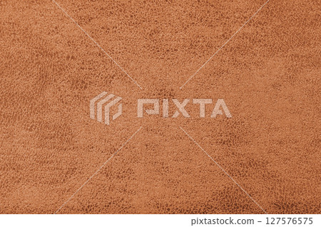 Structure of orange suede fabric with abstract shabby texture with shades closeup, macro. 127576575