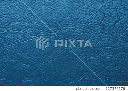 Close up, macro texture of blue glossy natural genuine leather, leatherette structure 127576576