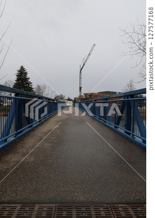 A bridge with a crane in the background A bridge with a crane in the background 127577168
