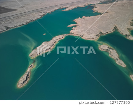 Aerial view of desert islands and peninsula in Kuimazar Reservoir landscape Aerial view of desert islands and peninsula in Kuimazar Reservoir landscape 127577390