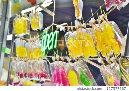 Fruit candy at a night food stall 127577667