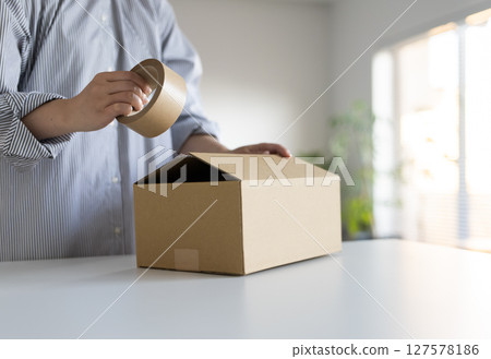 Cardboard box and ladies 127578186