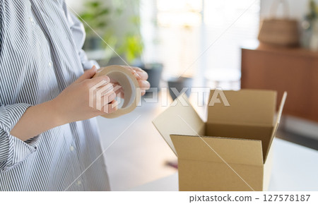 Cardboard box and ladies 127578187