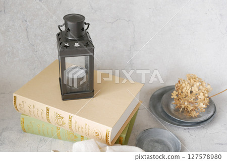 Scenery with antique lantern and books Scenery with antique lantern and books 127578980