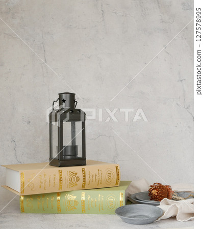 Scenery with antique lantern and books Scenery with antique lantern and books 127578995