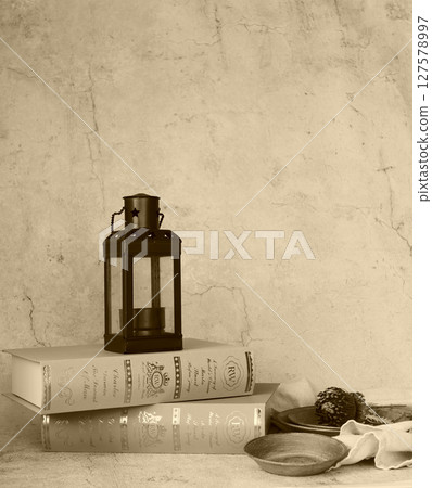 Scenery with antique lantern and books Scenery with antique lantern and books 127578997