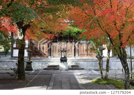 A temple surrounded by autumn leaves A temple surrounded by autumn leaves 127579204