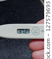 A thermometer reading 37.2℃ 127579693