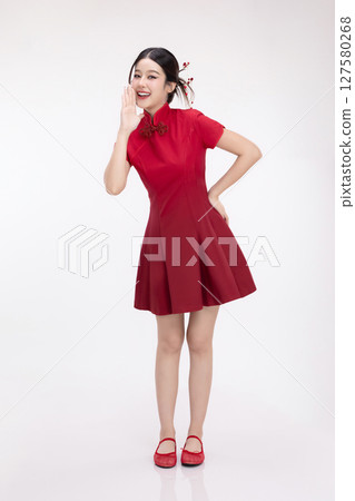 Full body portrait of joyful beauty Asian woman in red Cheongsam Chinese traditional dress celebrating and announcing isolated on white background. Full body portrait of joyful beauty Asian woman in red Cheongsam Chinese traditional dress celebrating and announcing isolated on white background. 127580268