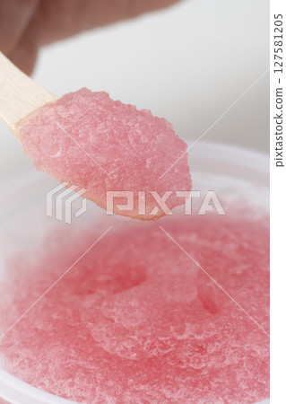 Strawberry shaved ice, strawberry ice, lifted with a wooden spoon Strawberry shaved ice, strawberry ice, lifted with a wooden spoon 127581205