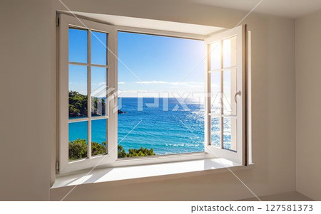 A white room with an open window overlooking the sea. A refreshing view of the ocean. 127581373