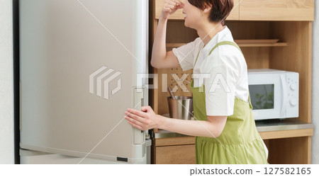 Woman suffering from smelly refrigerator 127582165