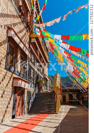Colorful Tibetan Prayer Flags and Architecture of Songzanlin Monastery 127582312