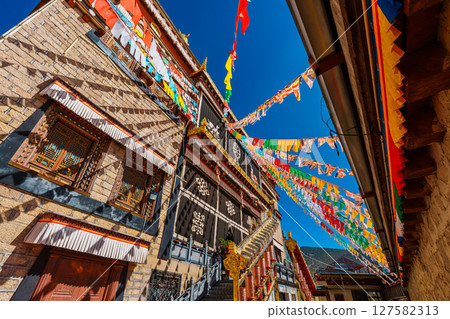 Colorful Tibetan Prayer Flags and Architecture of Songzanlin Monastery 127582313