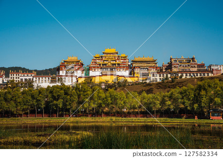 Songzanlin Monastery Reflecting in a Tranquil Lake in Shangri la 127582334