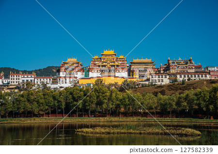 Songzanlin Monastery Reflecting in a Tranquil Lake in Shangri la 127582339