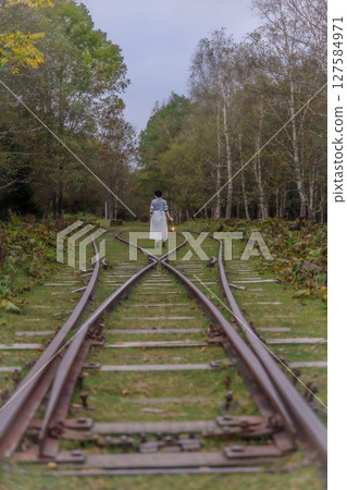 Lantern lights and an abandoned railway line intersection 127584971
