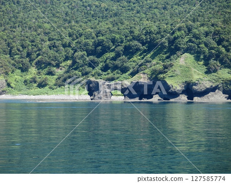 Spectacle Rocks as seen from the Shiretoko sightseeing boat Aurora (the unexplored Shiretoko Cape route) 127585774