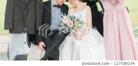 Kissing car wedding/bridal car wedding photo shoot for bride and groom/couple Kissing car wedding/bridal car wedding photo shoot for bride and groom/couple 127586234