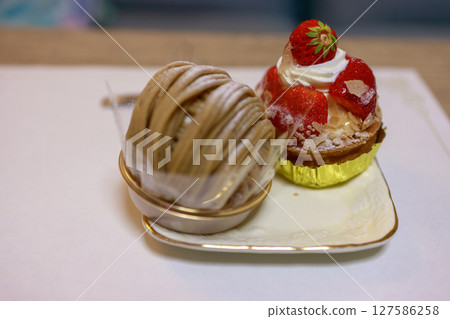 Enjoy a delicious afternoon with cake and coffee 127586258