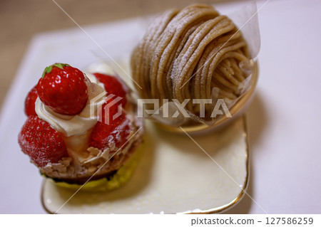 Enjoy a delicious afternoon with cake and coffee 127586259