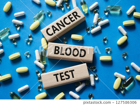 Cancer Blood Test symbol. Concept word Cancer Blood Test on wooden blocks. Beautiful blue background with pills. Medicine and Cancer Blood Test concept. Copy space Cancer Blood Test symbol. Concept word Cancer Blood Test on wooden blocks. Beautiful blue background with pills. Medicine and Cancer Blood Test concept. Copy space 127586306