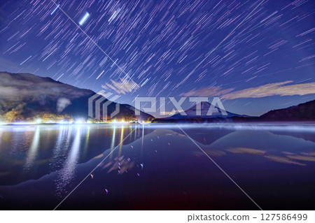 Night view of Mt. Fuji and the rising winter constellations from Lake Shojiko Night view of Mt. Fuji and the rising winter constellations from Lake Shojiko 127586499