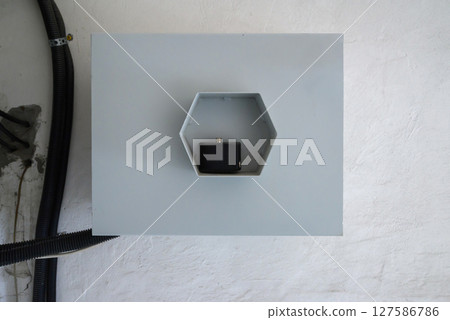 interior of building with electrical junction box and cable on wall 127586786