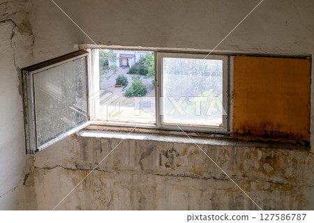 interior of dirty wall in old house with wooden windows 127586787