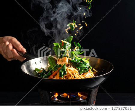 AI generated sizzling thai pad pak boong fai daeng with fresh ingredients falling into ornate thai bowl crispy water spinach garlic chili oyster sauce AI generated sizzling thai pad pak boong fai daeng with fresh ingredients falling into ornate thai bowl crispy water spinach garlic chili oyster sauce 127587031