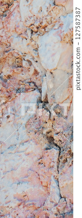 Surface of natural stone with rough texture eroded in high resolution. Surface of natural stone with rough texture eroded in high resolution. 127587387