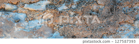 Horizontal shot of eroded rock texture backdrop.Abstract Stone Background 127587393