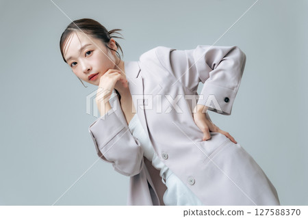 Fashion image of a woman wearing a jacket, cosmetics, beauty, skin care Fashion image of a woman wearing a jacket, cosmetics, beauty, skin care 127588370