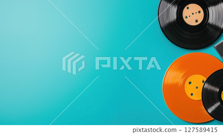 Vibrant vinyl records and teal background music nostalgia Vibrant vinyl records and teal background music nostalgia 127589415