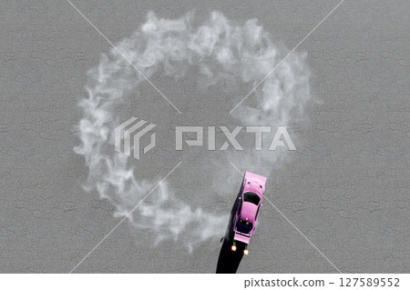 Image of a pink modified car doing donut turns and drifting 127589552