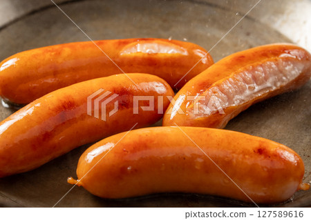 Grilling Vienna sausages 127589616