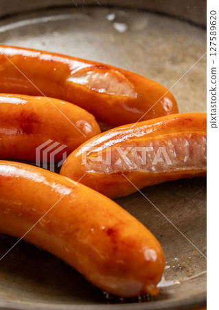 Grilling Vienna sausages Grilling Vienna sausages 127589620
