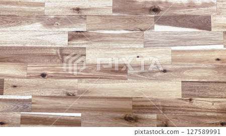 op view of light to medium tone wood laminate flooring with visible wood grain and knots, perfect for backgrounds, interior design mockups, or architectural renderings. 127589991