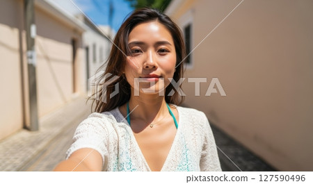 Selfie, portrait photo of young Japanese woman 127590496