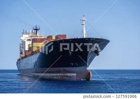 Big container ship in the middle of the sea Big container ship in the middle of the sea 127591906