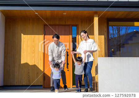 A Japanese family gathering in front of their house A Japanese family gathering in front of their house 127592078