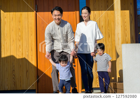 A Japanese family gathering in front of their house A Japanese family gathering in front of their house 127592080
