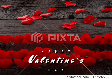 Heart Decorations and Valentine's Day Greeting On Wooden Table Background 127592282