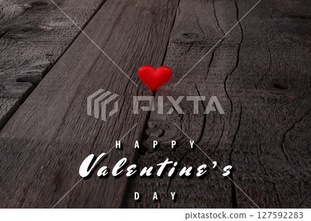 Romantic Valentine's Day Heart on Rustic Wooden Background with Holiday Greeting Romantic Valentine's Day Heart on Rustic Wooden Background with Holiday Greeting 127592283