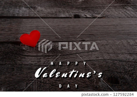 Red Heart Shape on Rustic Wooden Background with Happy Valentine's Day Text 127592284
