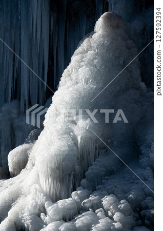 Large ice blocks and icicles Large ice blocks and icicles 127592394