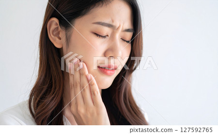 Young woman suffering from toothache Young woman suffering from toothache 127592765